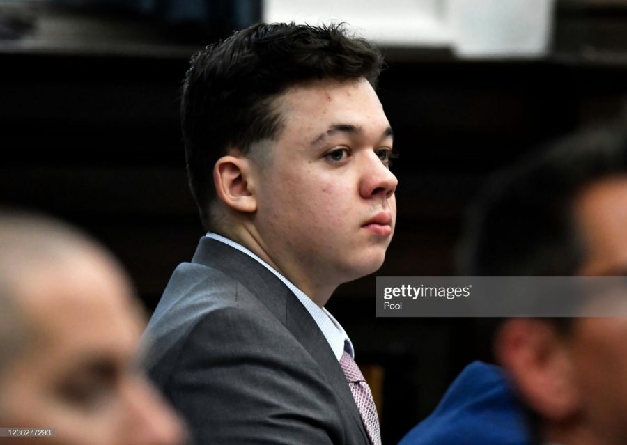 KENOSHA, WISCONSIN - NOVEMBER 01: Kyle Rittenhouse listens as jurors are asked questions by the judge during jury selection at the Kenosha County Courthouse on November 01, 2021 in Kenosha, Wisconsin. Rittenhouse shot three demonstrators, killing two of them, during a night of unrest that erupted in Kenosha after a police officer shot Jacob Blake seven times in the back while police attempted to arrest him in August 2020. Rittenhouse, from Antioch, Illinois, was 17 at the time of the shooting and armed with an assault rifle. He faces counts of felony homicide and felony attempted homicide. (Photo by Sean Krajacic-Pool/Getty Images)
