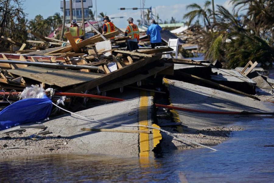 Responders+from+the+de+Moya+Group+survey+damage+to+the+bridge+leading+to+Pine+Island%2C+to+start+building+temporary+access+to+the+island+in+the+aftermath+of+Hurricane+Ian+in+Matlacha%2C+Fla.%2C+Sunday%2C+Oct.+2%2C+2022.+The+only+bridge+to+the+island+is+heavily+damaged+so+it+can+only+be+reached+by+boat+or+air.+%28AP+Photo%2FGerald+Herbert%29