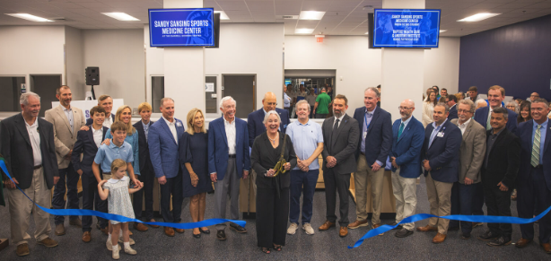 


UWF President Dr. Martha Saunders and other benefactors cut the ribbon for the new Sandy Sansing Sports Medicine Center. 