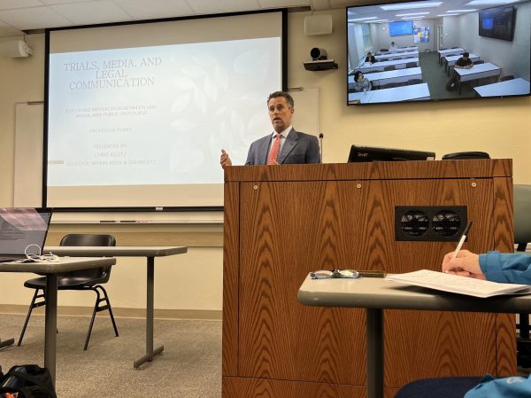 Attorney J. Christopher Klotz lectures in Building 74.