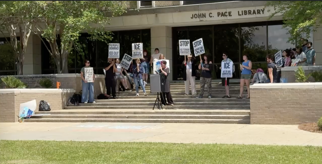 UWF Students protest the University's 287(g) agreement with ICE on Tuesday, April 14 on the steps of Pace Library on the Pensacola Campus.